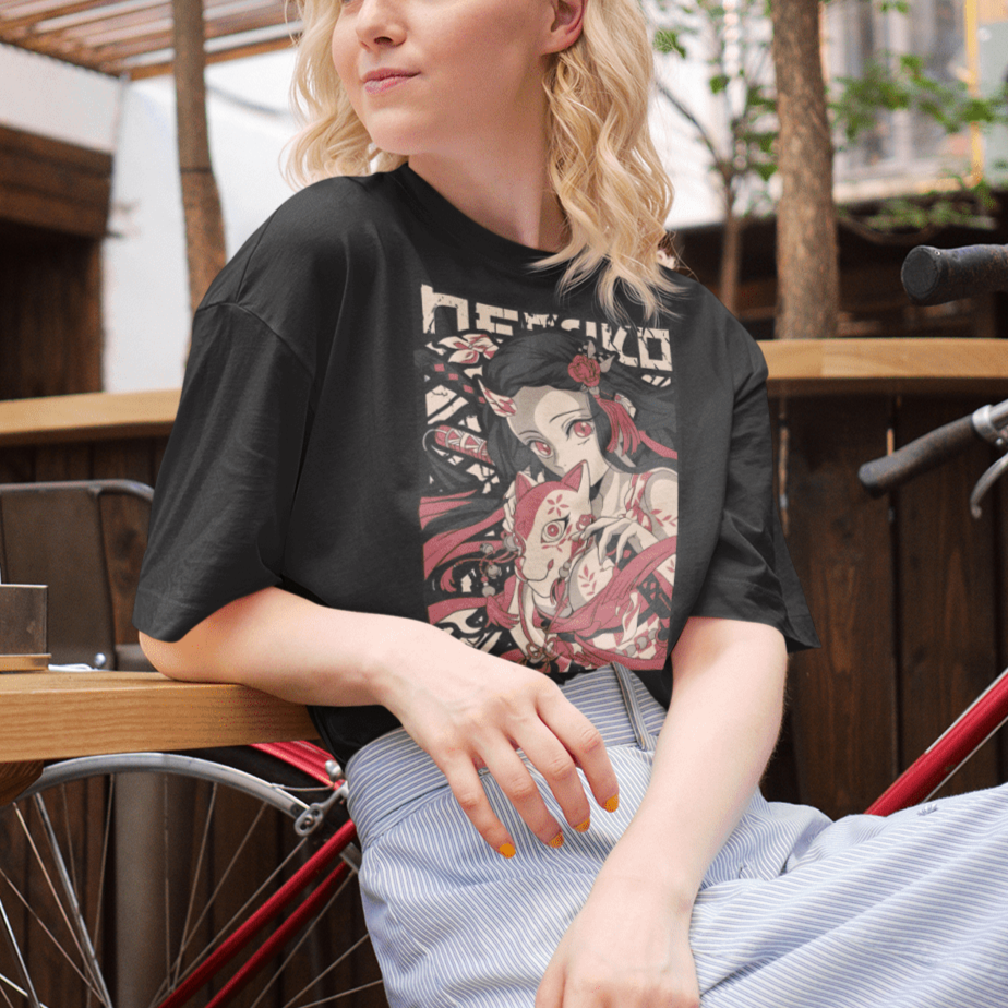 a blonde hair young woman laughing wearing a black unisex round neck tshirt