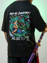 Person wearing a black t-shirt with a colorful dragon design on the back, holding a sword.