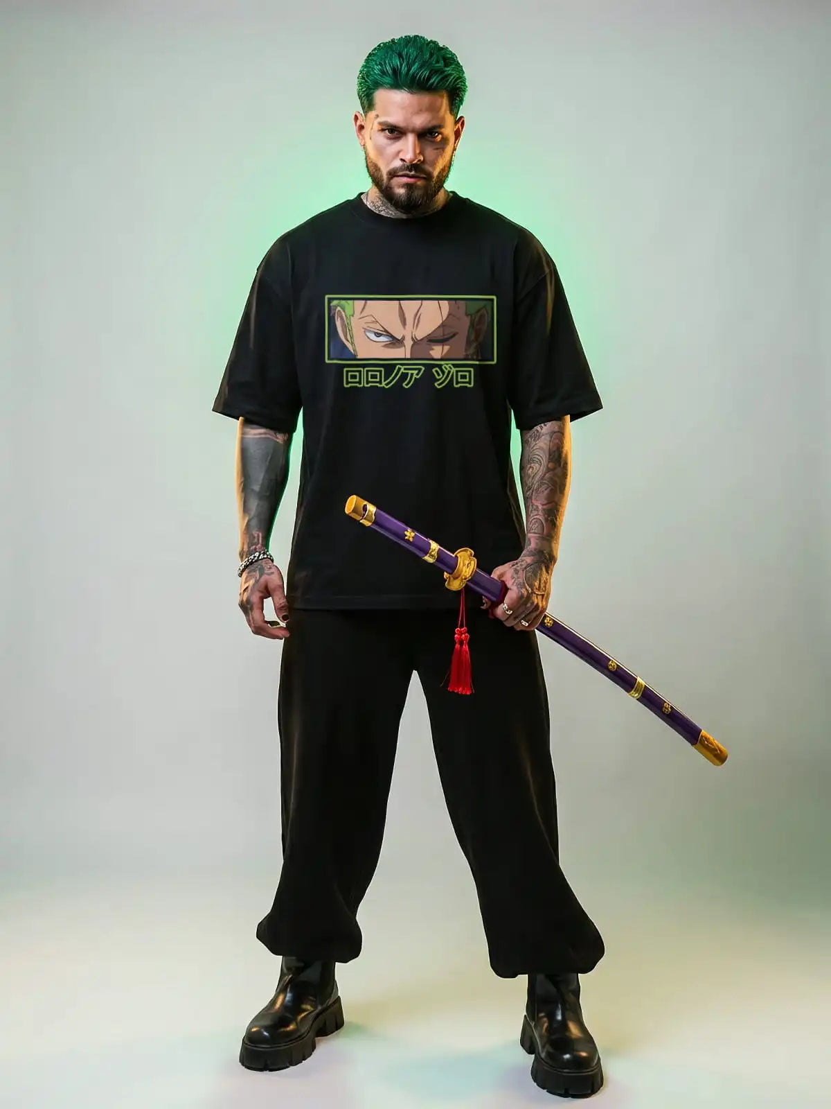 Person wearing a black t-shirt with a graphic design, holding a sword against a gradient background
